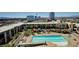 Expansive aerial view of the community's pool, landscaping, and vibrant cabanas at 353 E Bonneville Ave # 181/281, Las Vegas, NV 89101
