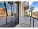 Balcony with railing and glass door allows for an amazing outdoor view at 353 E Bonneville Ave # 181/281, Las Vegas, NV 89101