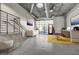 Spacious living area featuring concrete floors, industrial style ceilings, and modern furniture at 353 E Bonneville Ave # 181/281, Las Vegas, NV 89101