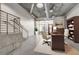 Open living area features concrete floors, industrial ceilings, and a cozy workspace at 353 E Bonneville Ave # 181/281, Las Vegas, NV 89101