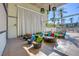 Comfortable outdoor lounge area with vibrant pillows and unique hanging light fixtures at 353 E Bonneville Ave # 181/281, Las Vegas, NV 89101