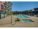 Beautiful community swimming pool and spa, surrounded by landscaping, and residences at 353 E Bonneville Ave # 181/281, Las Vegas, NV 89101