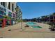 Resort-style pool and spa area with poolside seating and lush palm trees at 353 E Bonneville Ave # 181/281, Las Vegas, NV 89101