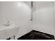 Plain utility sink in a room with white walls, dark floors, and exposed ductwork at 353 E Bonneville Ave # 181/281, Las Vegas, NV 89101
