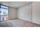 Bedroom with carpeted floors and a large window offering natural light at 353 E Bonneville Ave # 503, Las Vegas, NV 89101