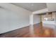 Spacious living room featuring hardwood floors and an open floor plan leading to a modern kitchen at 353 E Bonneville Ave # 503, Las Vegas, NV 89101