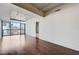 Bright living room with hardwood floors and large windows offering city views at 353 E Bonneville Ave # 503, Las Vegas, NV 89101
