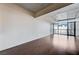Bright living room with hardwood floors and large windows offering city views at 353 E Bonneville Ave # 503, Las Vegas, NV 89101