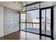 Bright living room with hardwood floors and floor-to-ceiling windows offering city views at 353 E Bonneville Ave # 503, Las Vegas, NV 89101
