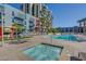 Luxury community pool with a hot tub and lounge seating at 353 E Bonneville Ave # 503, Las Vegas, NV 89101
