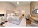 Comfortable bedroom with natural light, a neutral color scheme, and attached bath at 382 Chaplin Cove Ave, Las Vegas, NV 89183