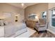 Serene bedroom with hardwood floors, a sitting area, and lots of natural light at 382 Chaplin Cove Ave, Las Vegas, NV 89183