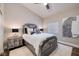 Stylish bedroom with a plush bed, decorative pillows, and modern artwork at 382 Chaplin Cove Ave, Las Vegas, NV 89183