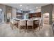 Spacious kitchen featuring a stone-wrapped island with seating and top-of-the-line stainless steel appliances at 382 Chaplin Cove Ave, Las Vegas, NV 89183