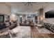 Open concept living room showcasing hardwood floors and seamless transition to dining area at 382 Chaplin Cove Ave, Las Vegas, NV 89183