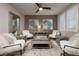 Comfortable living room with stylish decor, plush seating, and plenty of natural light through plantation shutters at 382 Chaplin Cove Ave, Las Vegas, NV 89183