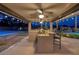 An incredible outdoor kitchen sits next to the pool and sport court at 382 Chaplin Cove Ave, Las Vegas, NV 89183