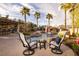 Beautiful pool area featuring a rock waterfall, spa, outdoor bar, and comfortable seating at 382 Chaplin Cove Ave, Las Vegas, NV 89183
