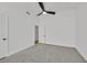 A well-lit bedroom features gray carpet, white walls, and a modern ceiling fan at 4137 Buffalo Bill Ave, Las Vegas, NV 89110