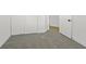 Bedroom with neutral carpet, sliding-door closets, white walls, and white trim at 4137 Buffalo Bill Ave, Las Vegas, NV 89110