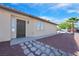 A single story home has low maintenance desert landscaping, a security door, and a tiled roof at 4137 Buffalo Bill Ave, Las Vegas, NV 89110