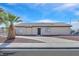 A single story home has desert landscaping, a security door, and is located on a corner lot at 4137 Buffalo Bill Ave, Las Vegas, NV 89110