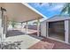 A covered back patio has a small storage shed and low maintenance desert landscaping at 4137 Buffalo Bill Ave, Las Vegas, NV 89110