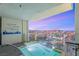 Balcony with a luxurious hot tub overlooking the dazzling Las Vegas skyline at twilight at 4381 W Flamingo Rd # 57306, Las Vegas, NV 89103