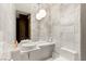 Modern bathroom with marble walls, a sleek vanity, and elegant lighting, providing a spa-like experience at 4381 W Flamingo Rd # 57306, Las Vegas, NV 89103