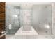 Modern bathroom with glass-enclosed shower, soaking tub, and sleek marble finishes at 4381 W Flamingo Rd # 57306, Las Vegas, NV 89103