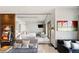 Modern bedroom with sleek sliding glass doors, lounge seating, and a fun vintage slot machine at 4381 W Flamingo Rd # 57306, Las Vegas, NV 89103