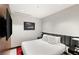Modern bedroom featuring a plush bed, sleek furniture, and an entertainment center at 4381 W Flamingo Rd # 57306, Las Vegas, NV 89103