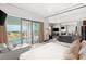 Spacious bedroom with a large balcony offering city views, complemented by stylish furnishings at 4381 W Flamingo Rd # 57306, Las Vegas, NV 89103