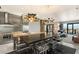 Sleek, modern kitchen with stainless steel appliances, granite counters, and breakfast bar seating at 4381 W Flamingo Rd # 57306, Las Vegas, NV 89103