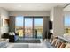Sophisticated living room features large windows, comfortable seating, and city views at 4381 W Flamingo Rd # 57306, Las Vegas, NV 89103