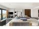 Open living room with city views, modern furnishings, and seamless indoor-outdoor living at 4381 W Flamingo Rd # 57306, Las Vegas, NV 89103