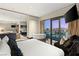 Bright, airy bedroom features an outdoor view, a soaking tub, and a cozy seating area, seamlessly blending comfort at 4381 W Flamingo Rd # 57306, Las Vegas, NV 89103