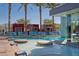 Stunning pool area with sun loungers and towering palm trees offers an oasis of relaxation at 4381 W Flamingo Rd # 57306, Las Vegas, NV 89103