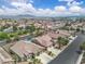 Overhead view of a home with a backyard pool, manicured landscaping, and solar panels at 4624 Ventana Rey St, North Las Vegas, NV 89081