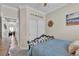Comfortable bedroom featuring a ceiling fan, neutral walls, and a double door closet at 4624 Ventana Rey St, North Las Vegas, NV 89081