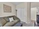Comfortable bedroom with plush seating, neutral walls, and a double door closet at 4624 Ventana Rey St, North Las Vegas, NV 89081