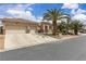 Exterior showcasing the home's facade, driveway, desert landscaping, and a two-car garage at 4624 Ventana Rey St, North Las Vegas, NV 89081