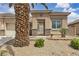Close-up of the front yard featuring desert landscaping and a secure gated entry at 4624 Ventana Rey St, North Las Vegas, NV 89081