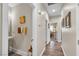 Hallway featuring vinyl floors, neutral paint, and access to bedrooms and bathrooms at 4624 Ventana Rey St, North Las Vegas, NV 89081