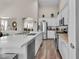 Modern kitchen featuring stone countertops, white cabinetry, stainless steel appliances, and an open layout at 4624 Ventana Rey St, North Las Vegas, NV 89081