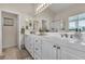 Beautifully lit main bathroom with dual sinks, ample counter space, and a large mirror at 4624 Ventana Rey St, North Las Vegas, NV 89081