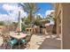 Outdoor dining area featuring a large table, seating, and a built-in grill under a shaded pergola at 4624 Ventana Rey St, North Las Vegas, NV 89081