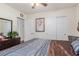 Bright bedroom with closet and dresser, featuring wall art and natural light from the window at 4808 Straight Flush Dr # 103, Las Vegas, NV 89122