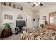 Bedroom featuring neutral walls and decor, complemented by a ceiling fan and recessed shelving at 4808 Straight Flush Dr # 103, Las Vegas, NV 89122
