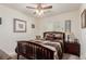Bedroom featuring a decorative color palette with bedside table and natural light from the window at 4808 Straight Flush Dr # 103, Las Vegas, NV 89122